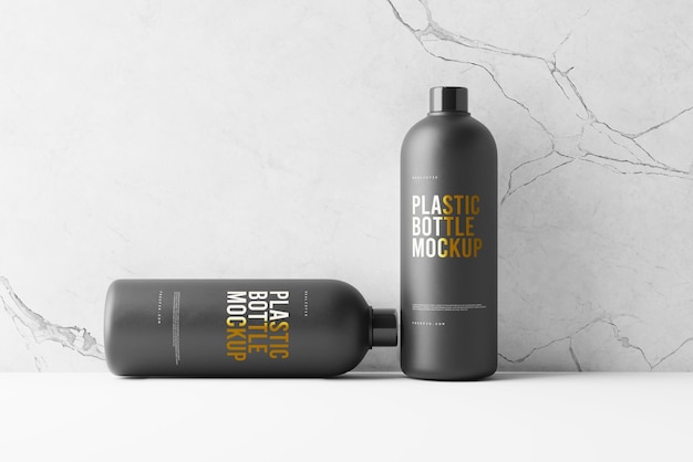 een zwarte fles plastic spray naast een zwarte bottel plastic spray