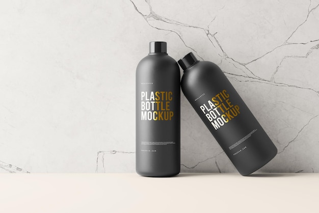 een zwarte fles plastic sprays naast een muur
