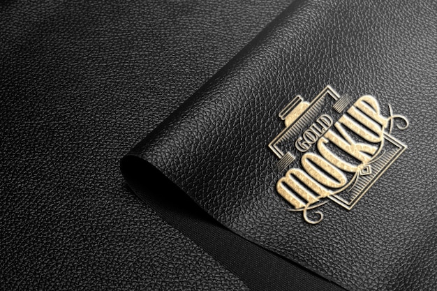 PSD effect gold logo mockup on black leather