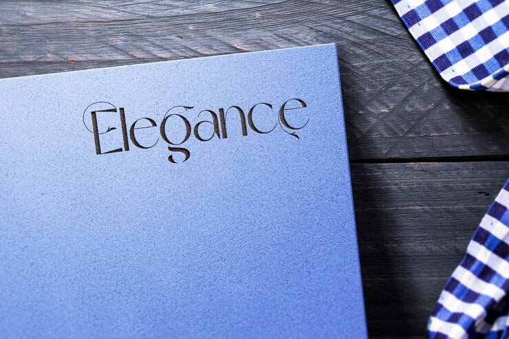 PSD elegance logo mockup on paper with wood background