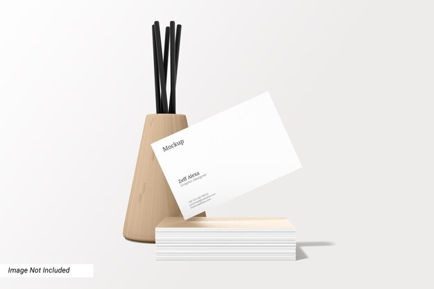 Elegant business card mockup with wooden decoration