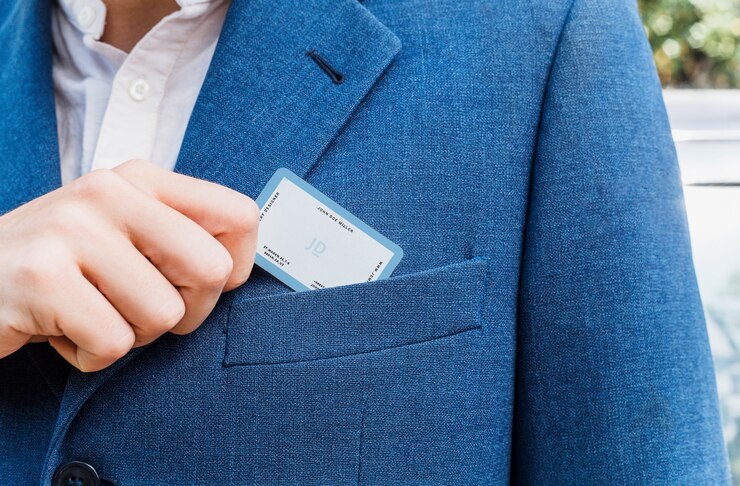 PSD elegant man pulling out business card