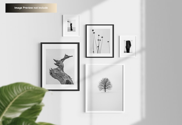 PSD elegant minimal photo frames mockup hanging on wall