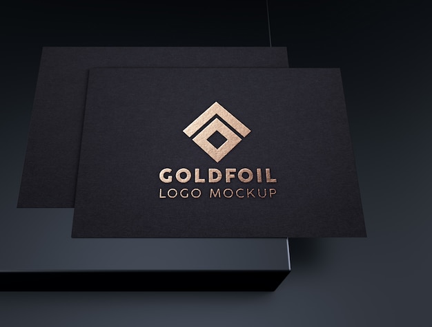 PSD elegante en luxe reliëf goudfolie logo mockup op zwart papier