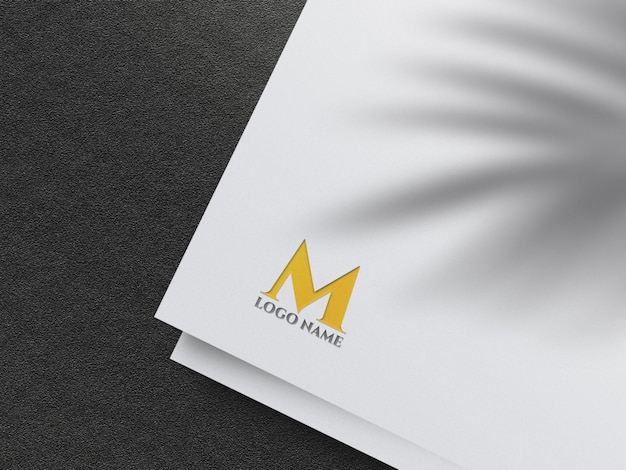 Emboss golden logo mockup on white paper