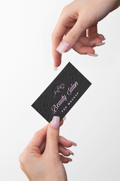 Embossed business card held in hand