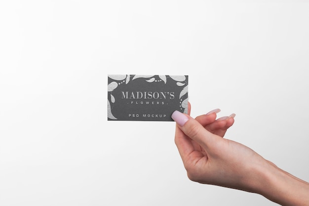 Embossed business card held in hand