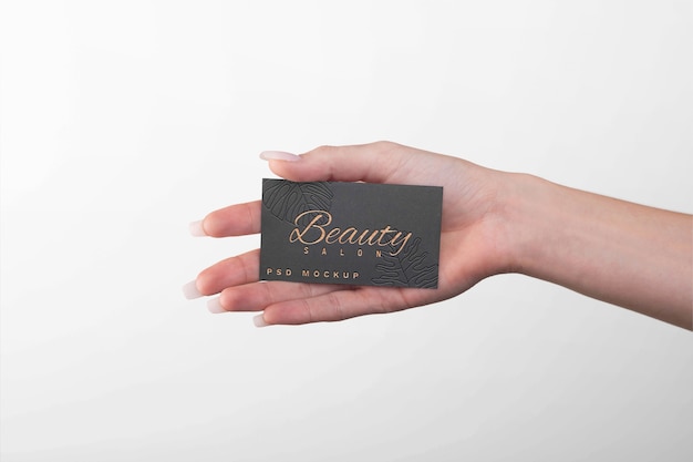 Embossed business card held in hand