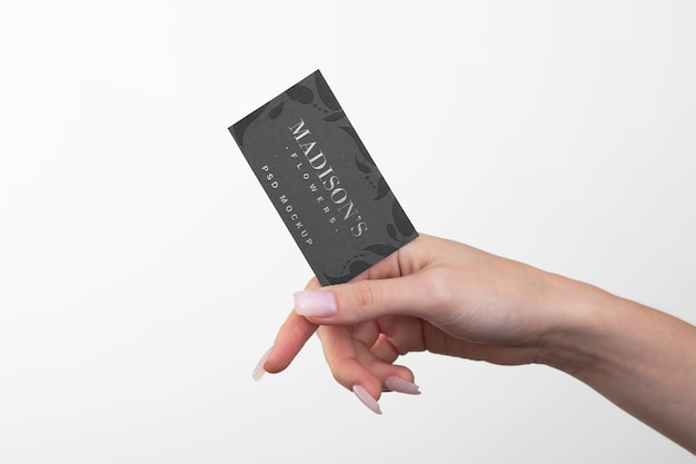 PSD embossed business card held in hand