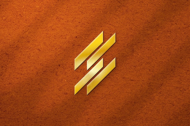 Embossed light gold logo mockup on orange colored texture background with shadow