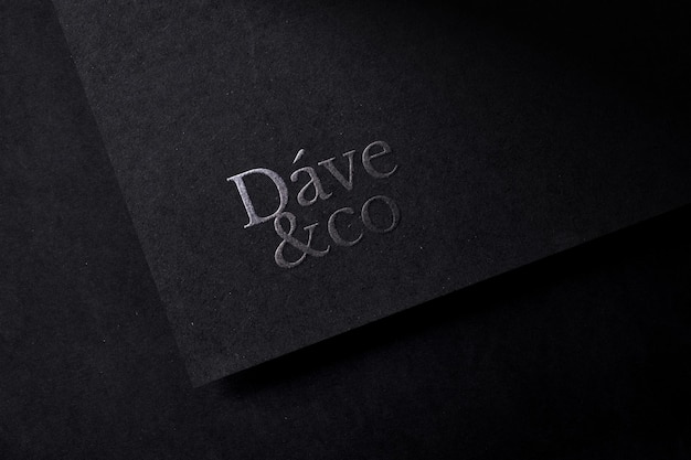 Premium PSD  Embossed logo mockup on dark paper