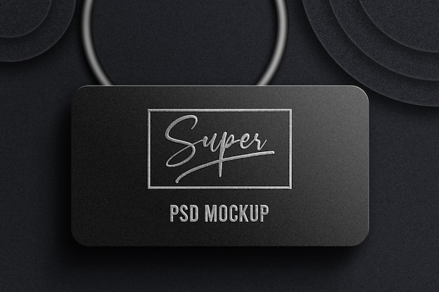 PSD embossed logo mockup on dark paper