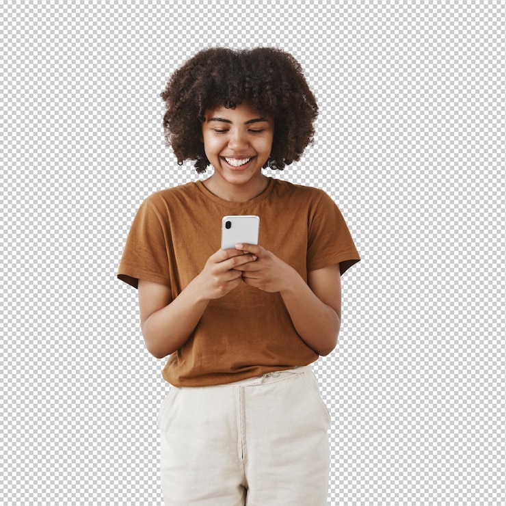 PSD entertained cute happy african american teenage girl with afro hairstyle in brown tshirt holding smartphone and laughing over funny video in internet using device to have fun