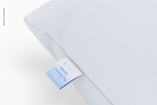 Etichetta quadrata per abbigliamento su cuscino mockup