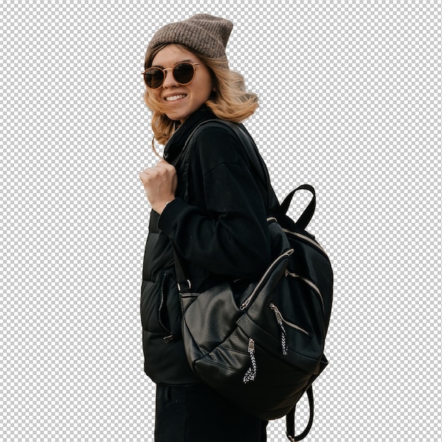 excited lovely pretty girl with short hairstyle wearing cap with backpack in sunglasses is walking on the beach