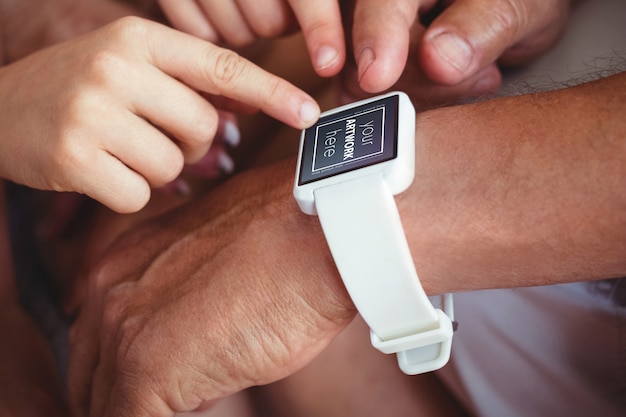 Family pointing at smart watch