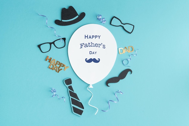 Father's day greeting balloon card with decoration on blue background copy space