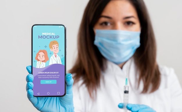 PSD female doctor holding a smartphone mock-up