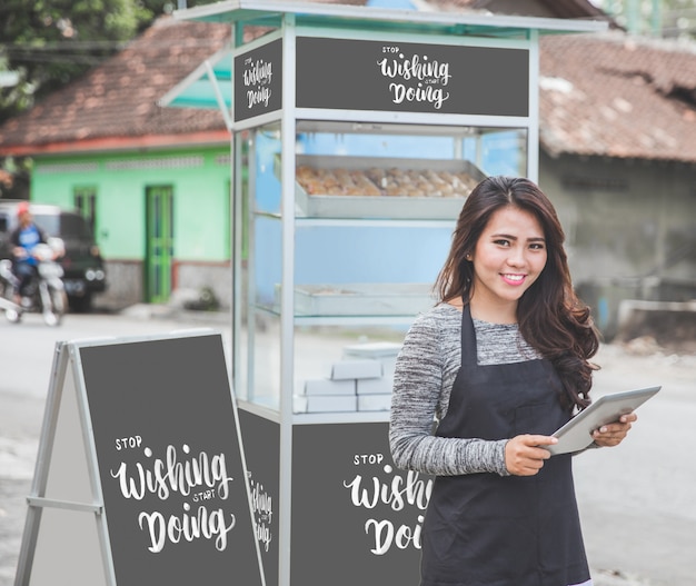 PSD female entrepreneur with her small business food stall mockup