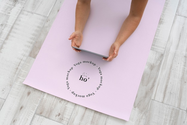 PSD female hands on yoga mat mock-up