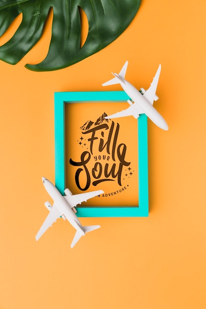 PSD fill your soul traveling, lettering with frame, airplanes and palm leaf