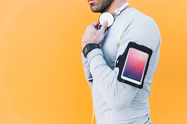 Fitness mockup with man with smartphone on arm