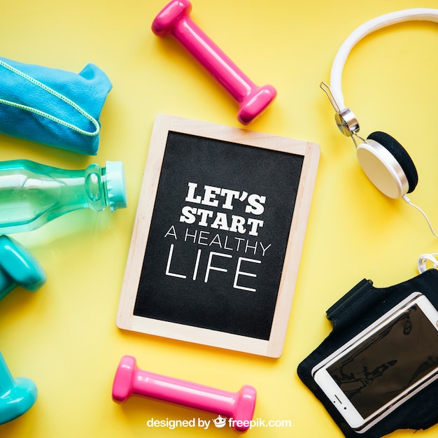 fitness mockup with slate and dumbbells