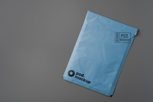 PSD flat lay over a4 envelope mockup