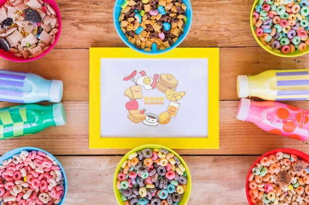 Flat lay of arrangement of cereals and milk bottles