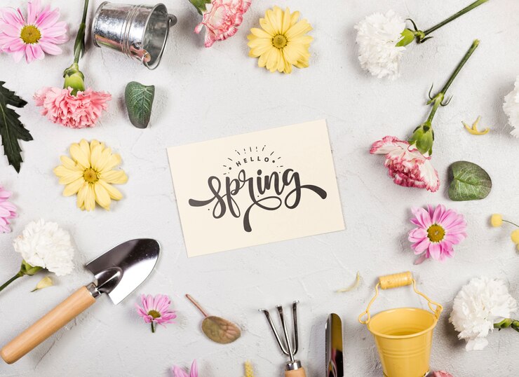 PSD flat lay of assortment of spring flowers and gardening tools