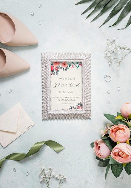 PSD flat lay assortment of wedding elements with frame mock-up