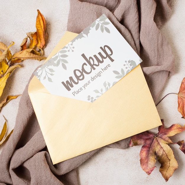 Flat lay autumn mock-up with leaves on grey cloth