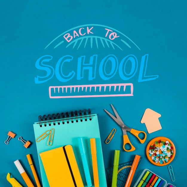 flat lay back to school with blue background