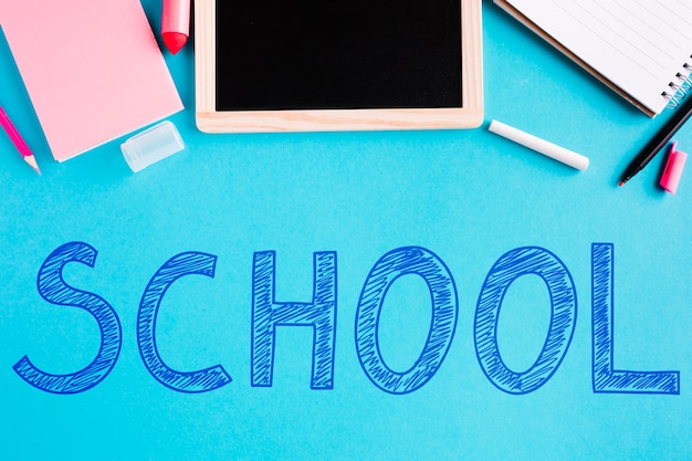 flat lay back to school with blue background