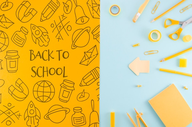 Flat lay back to school with yellow supplies