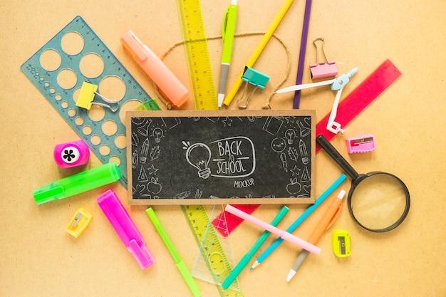 Flat lay blackboard and pens arrangement