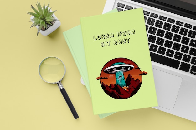 PSD flat lay books on laptop keyboard