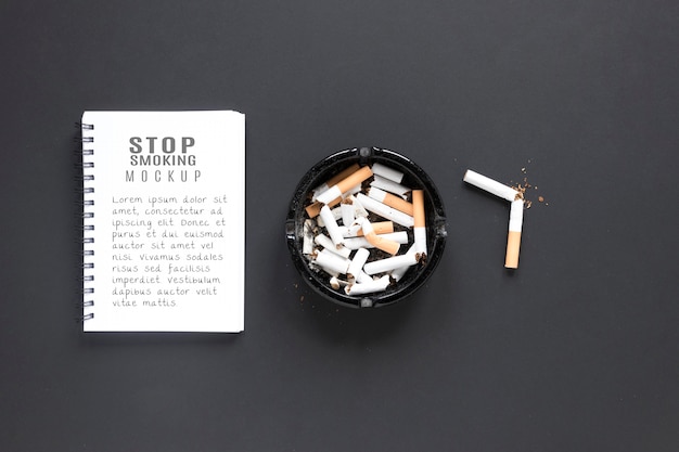 PSD flat lay broken cigarettes in ashtray