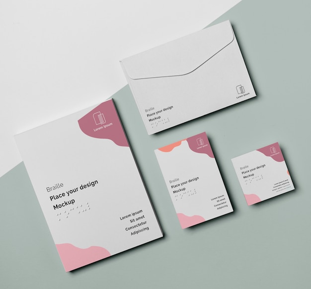 Flat lay of business card with braille and envelope