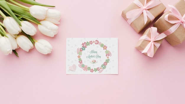 Flat lay of card with tulips and presents