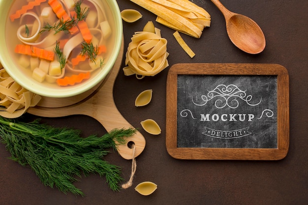 PSD flat lay of chalkboard with bowl of soup