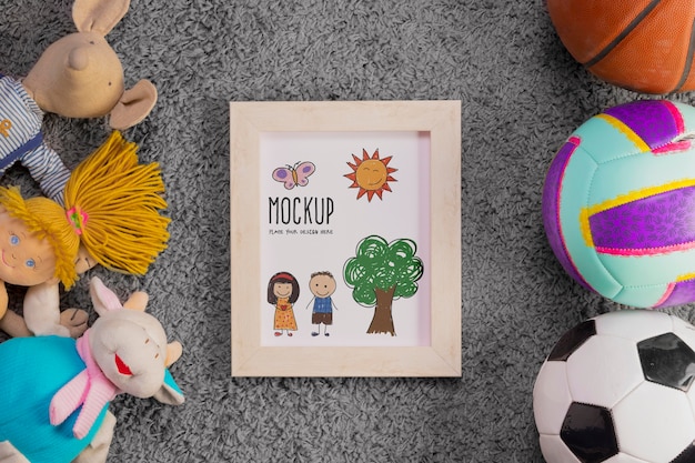 Flat lay of children toys and balls with frame