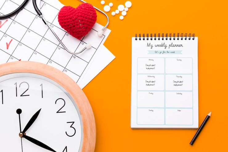 PSD flat lay clock on orange background