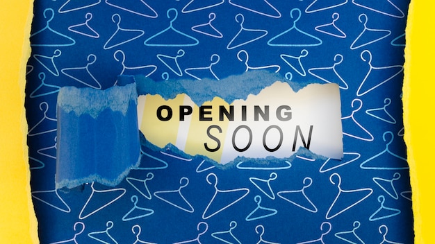 flat lay clothing store opening soon mock-up on paper