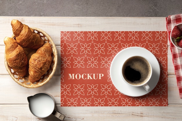 PSD flat lay croissants and coffee cup