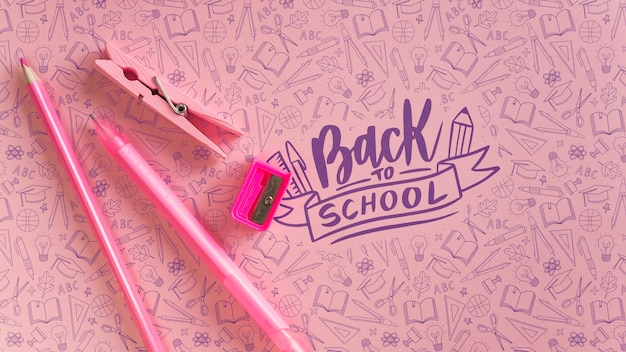 PSD flat lay decoration with pink school supplies