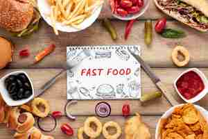 PSD flat lay of delicious fast foon on wooden table