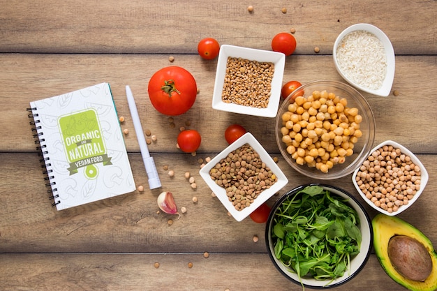 Flat lay delicious food with notebook and pen