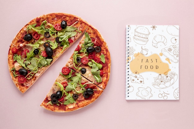 PSD flat lay of delicious pizza on plain background mock-up