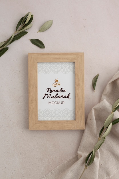 PSD flat lay of frame mockup with candle and leaves